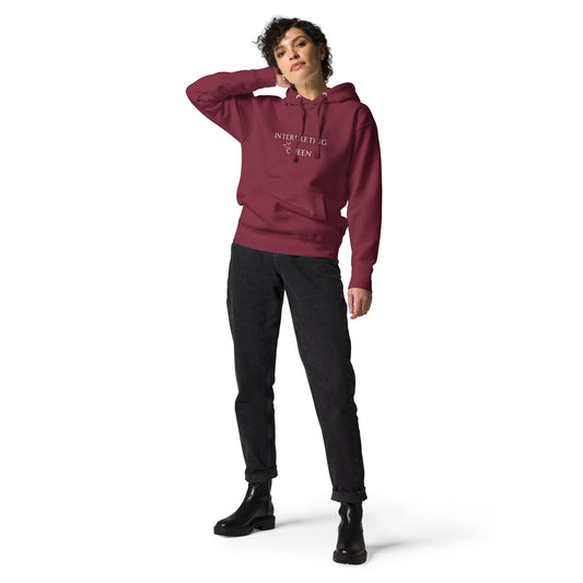Maroon hoodie with the text "Interpreting Queen" with a small crown on top of the letter Q in Queen.