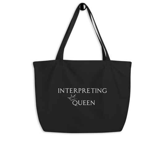 Black tote bag with white text "Interpreting Queen" with a small crown on top of the letter Q in Queen.